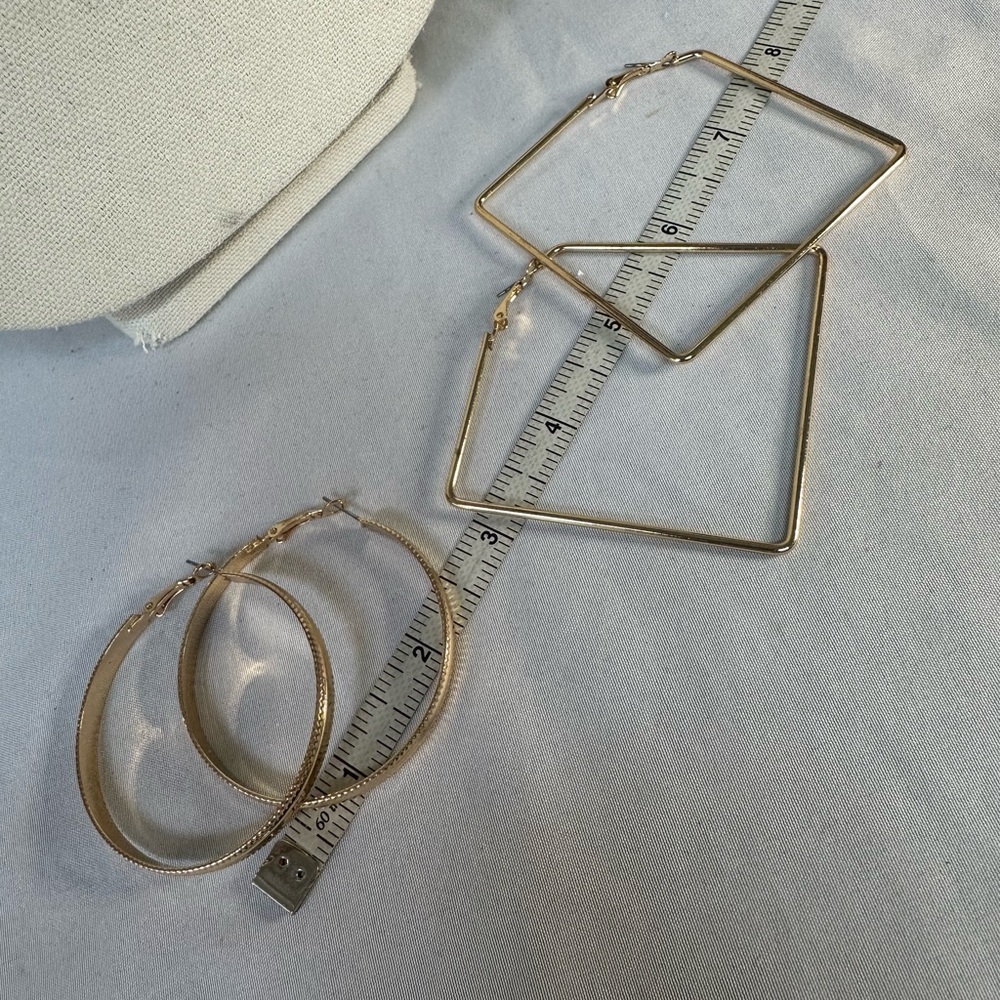 Two pair large goldtone fashion hoop earrings